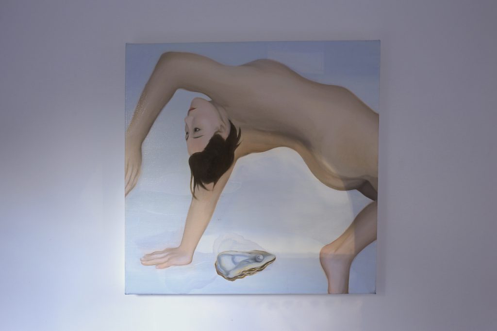 A painting of a nude female bending backwards with a pearl oyster underneath her.